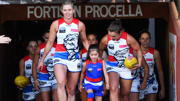 New beginnings: Western Bulldogs head out on to the field for their first game in season three of the AFLW.