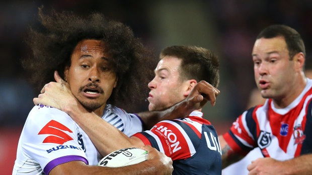 Hair today: Luke Keary grapples with Felise Kaufusi, a clump of whose hair somehow made its way into the Rooster's grasp.