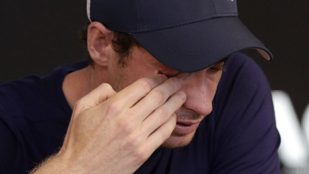 Andy Murray wipes tears from his face.