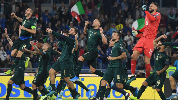 Italy celebrate their qualification after beating Greece in Rome.