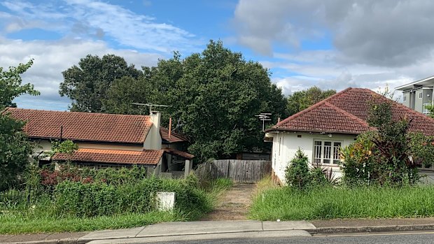 Neighbouring empty homes at 1 and 5 Kennington Road, Camp Hill, where a local builder has approval to build nine townhouses.