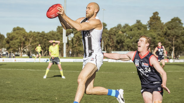 Strong showing: Ben Reid marks for Collingwood at Casey Fields on Sunday.