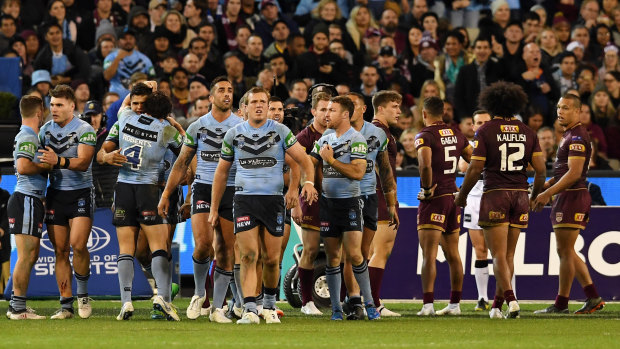 The Blues walk away from their fans after scoring a try at the MCG last night.