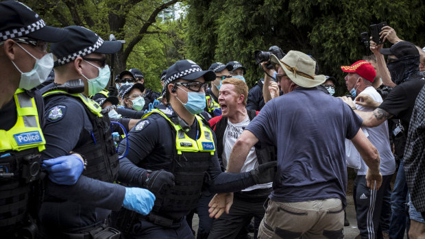 Police and protesters class at the Shrine of Remembrance.