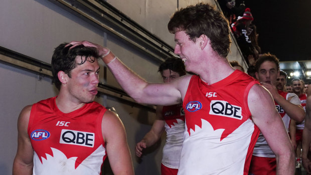 Young Swans Oliver Florent (left) and Nick Blakey celebrate the big win over the Demons.