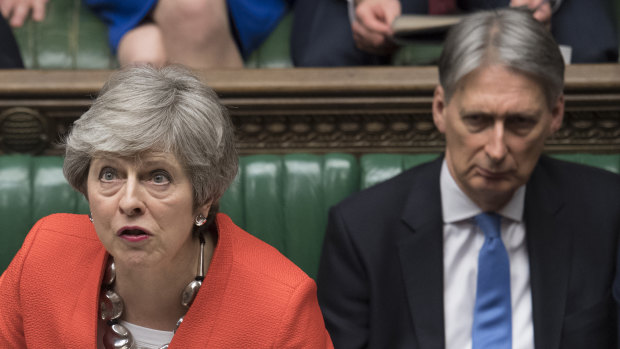 British Prime Minister Theresa May speaks in Parliament on Tuesday when her bid for an orderly exit from the European Union was defeated again.
