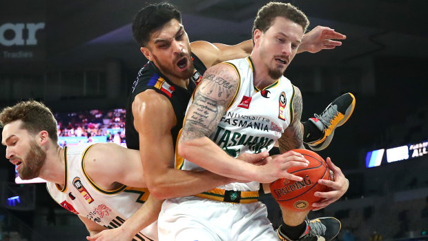 JackJumpers Josh Adams, front, and Jarred Bairstow collide with Shea Ili of United during the third semi-final encounter.