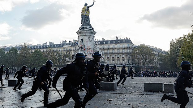 Police charge at protesters in the Place de la Republique in Paris on Saturday.