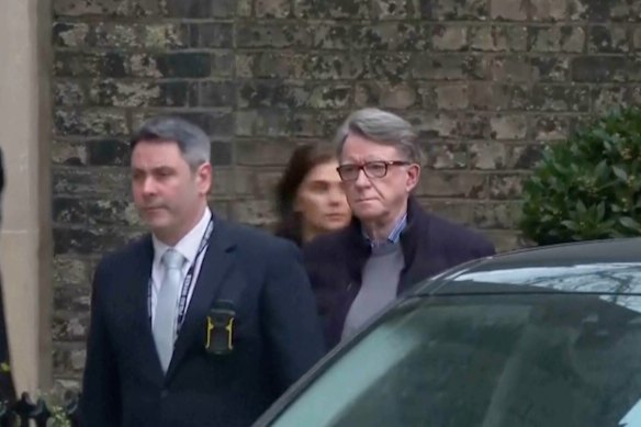 Peter Mandelson is escorted from his home in London’s Camden for questioning.