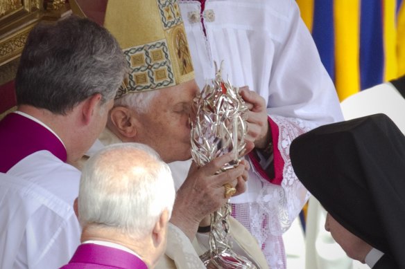 Pope Benedict XVI kisses the glass reliquary containing the blood of late Pope John Paul II, during the  beatification ceremony at the Vatican in 2011. The object has been stolen from a church in Spoleto, Italy.