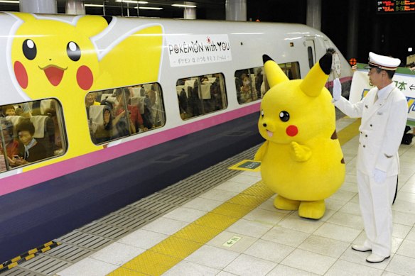 Beloved Pokemon character Pikachu waves at passengers on the themed train as they depart from Ueno station in Tokyo.