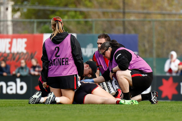 Amber Clarke receives medical attention after the clash.