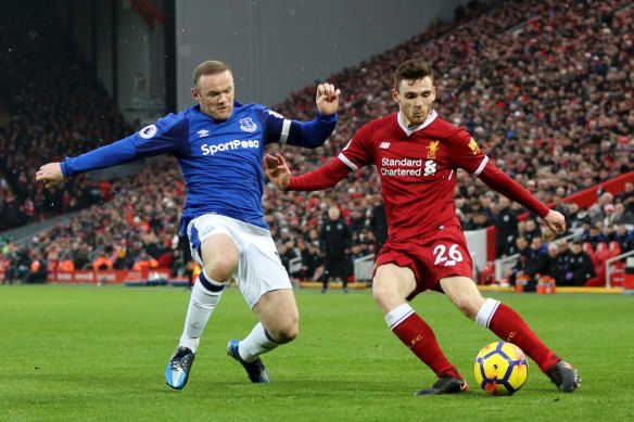 Andrew Robertson, right, battles Wayne Rooney, left, for the ball in 2017. 