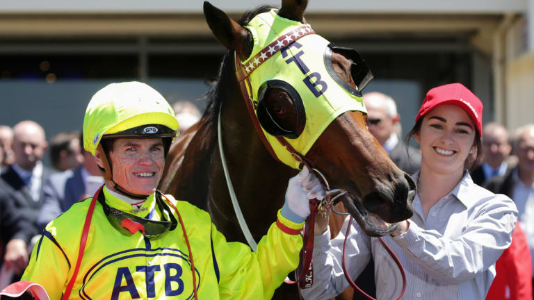 Meanwhile, at Sandown: Craig Williams returns to scale on Yogi, a winner for part-owner Cameron Percy.