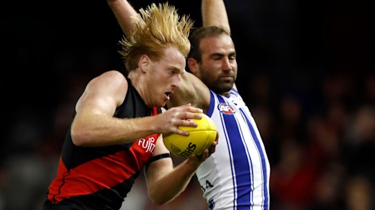 Essendon defender Aaron Francis in action against North Melbourne at Marvel Stadium.