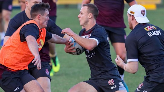 'Intense': Daly Cherry-Evans spots a gap during Maroons training at Langlands Park.