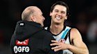 Port coach Ken Hinkley in a hoodie with a GFG sponsorhsip logo and captain Connor Rozee.