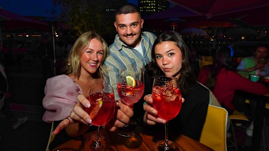 Ruby Keeble (from left), Daniel Moshopoulos and Elena Boyce enjoy drinks at the Arbory Afloat.