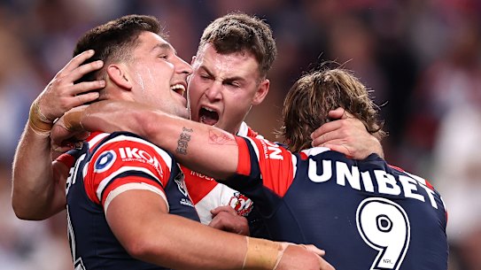 Victor Radley and the Roosters celebrate a try.