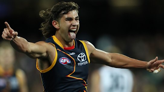Josh Rachele of the Crows celebrates a goal.