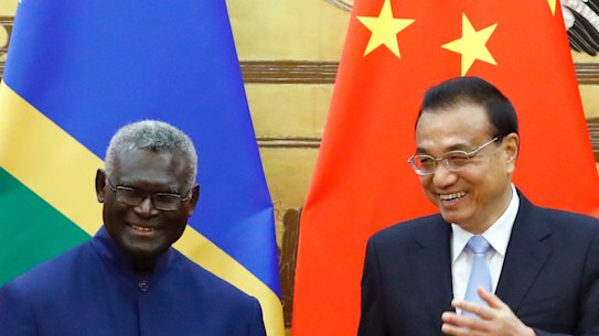 Solomon Islands Prime Minister Manasseh Sogavare with Chinese Premier Li Keqiang in Beijing in October 2019.
