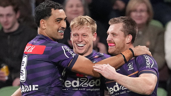 Tyran Wishart of the Storm celebrates with team mates after scoring a try during the round eight NRL match between Melbourne Storm and South Sydney Rabbitohs at AAMI Park.