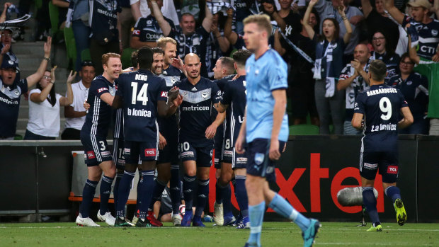 Ola Toivonen is swamped by teammates after scoring from a free kick against Sydney.