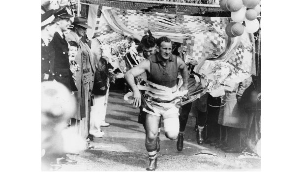 Footscray’s captain Charlie Sutton leads the team out.
