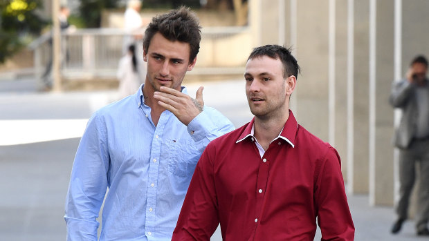 Luke Appleton (left) and Hayden Buchanan, who are friends of Alex McEwan, leave the Brisbane Supreme Court.  Two of McEwan's friends testified that violence was out of his character.