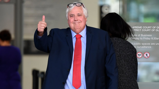 Businessman Clive Palmer gestures as he leaves the Supreme Court in Brisbane on Tuesday.