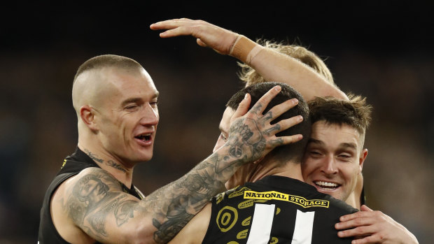 Dustin Martin congratulates Jason Castagna on kicking a goal in 2021.