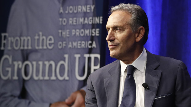 Former Starbucks CEO and Chairman Howard Schultz looks out at the audience.