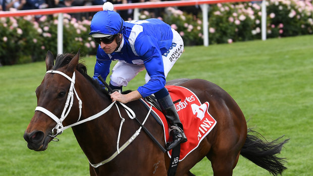 Welcome return: Hugh Bowman rides Winx to victory in the Cox Plate last year..