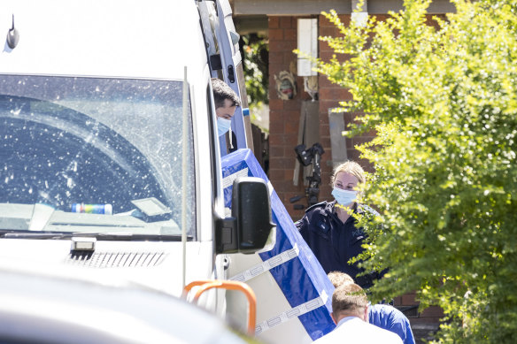 Police removed a freezer from the house on Thursday.