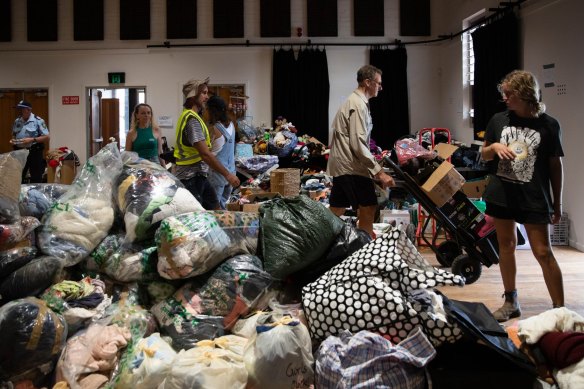 Mullumbimby locals manage donated goods for flood victims in March last year.