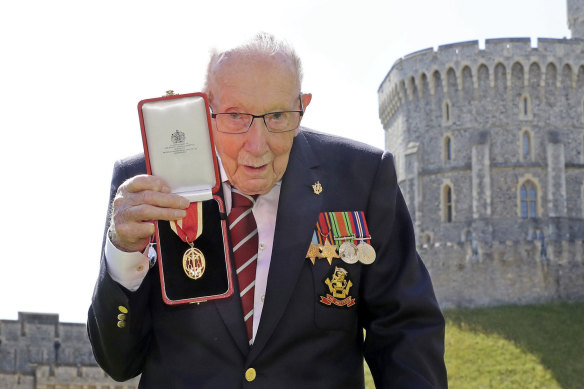 Sir Tom Moore after being knighted by the Queen.