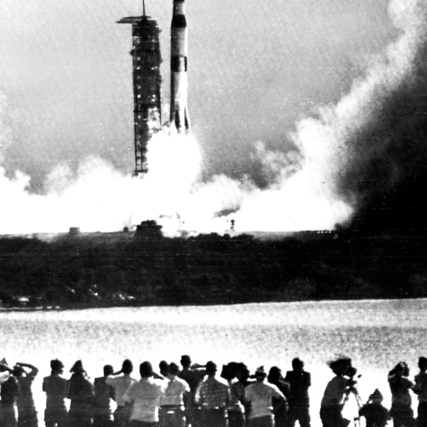 Members of the media and public watch as Apollo 11 blasts off, in this picture published on the front page of The Sydney Morning Herald in 1969. 