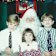 From left: Sean, his sister Samantha and brother Steven as children with Santa.