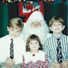 From left: Sean, his sister Samantha and brother Steven as children with Santa.