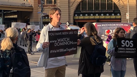 Protesters in the middle of the Flinders and Swanston streets intersection.