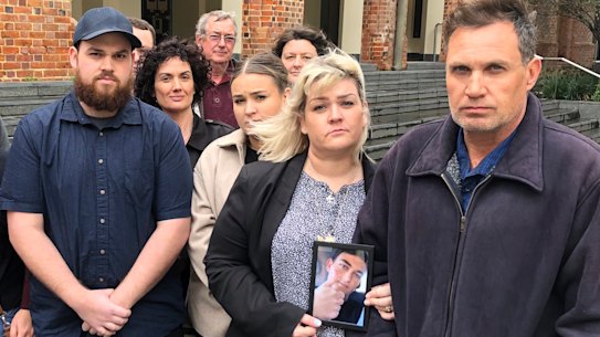 Pamela and Chris Fink, far right, were surrounded by family and supporters during the Supreme Court hearing where they sought to get an inquest into their son’s suicide.