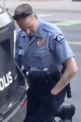Police officer Derek Chauvin kneels on George Floyd, who is out of frame.