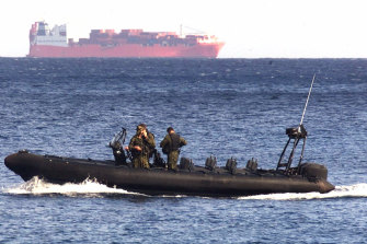 An Australian Army vessel patrols the waters near the Norwegian freighter Tampa in 2001. 