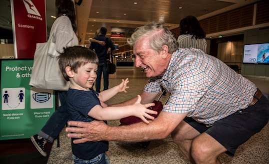 Alan Kinkade being greeted by Tom for the first time in months at Sydney Airport on Monday.