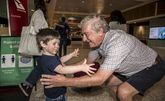 Alan Kinkade being greeted by Tom for the first time in months at Sydney Airport on Monday.