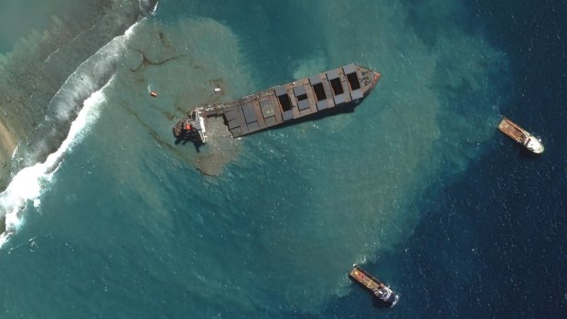 This satellite image provided by 2020 Maxar Technologies shows the MV Wakashio, a bulk carrier ship that recently ran aground off the southeast coast of Mauritius.