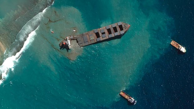 This satellite image provided by 2020 Maxar Technologies shows the MV Wakashio, a bulk carrier ship that recently ran aground off the southeast coast of Mauritius.