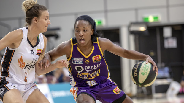Leading light: Lindsay Allen leans in on the Fire’s Mikhaela Donnelly on her way to a game-high 21 points for the Boomers. 