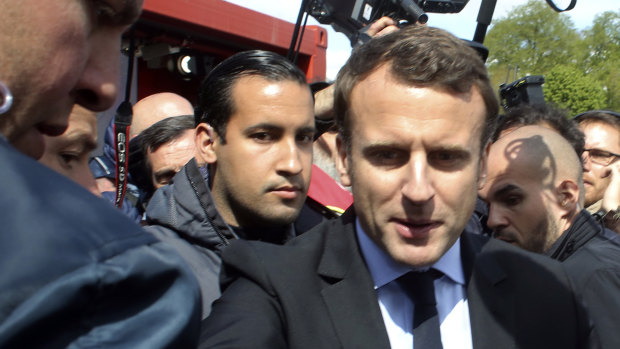Emmanuel Macron, right, is flanked by his bodyguard, Alexandre Benalla, left background, last year.