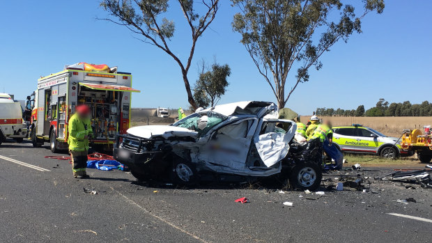 A teenager and woman have died as a result of the crash which involved a sedan, ute and semi-trailer.